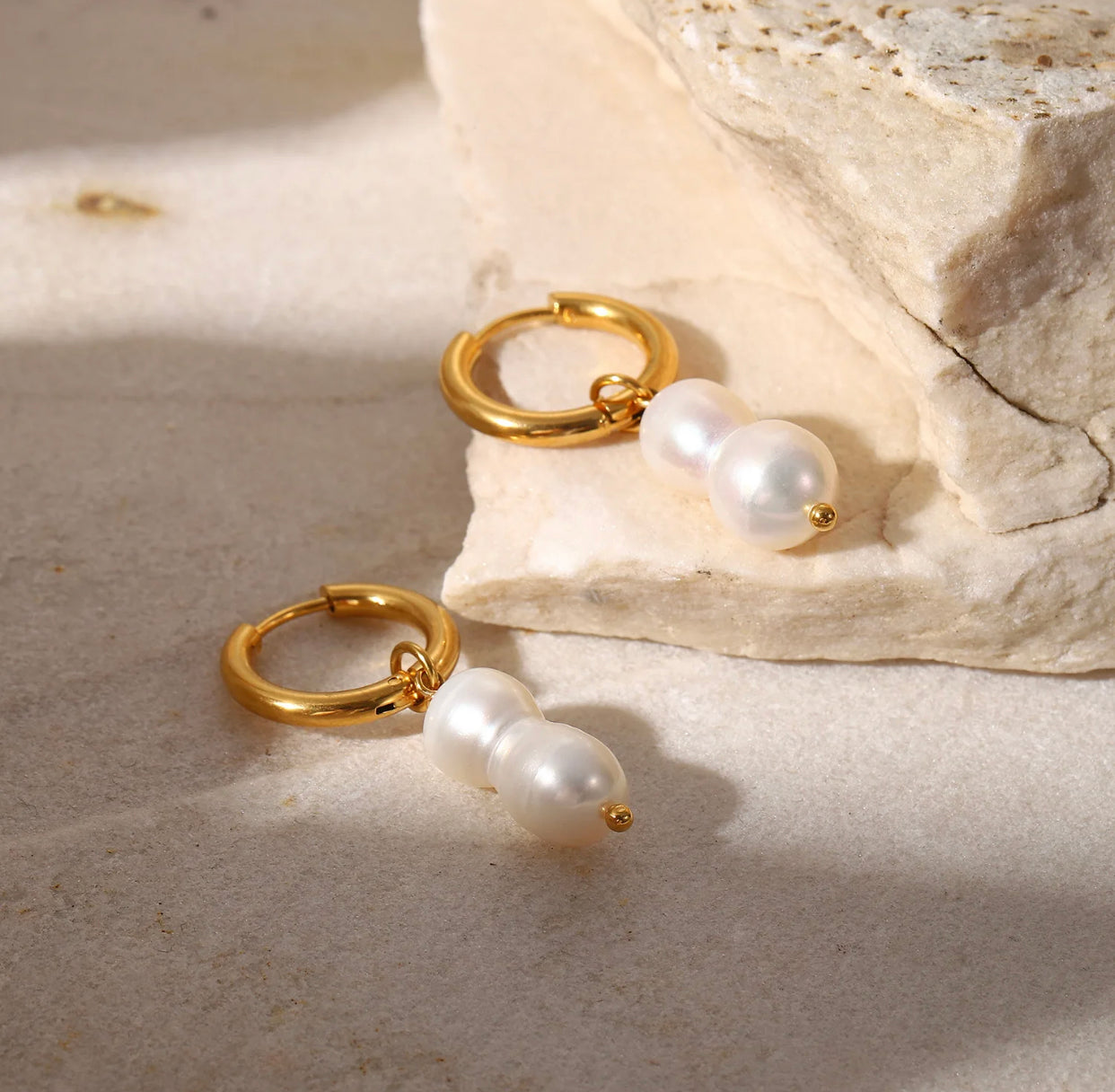 Double pearl pendant earrings